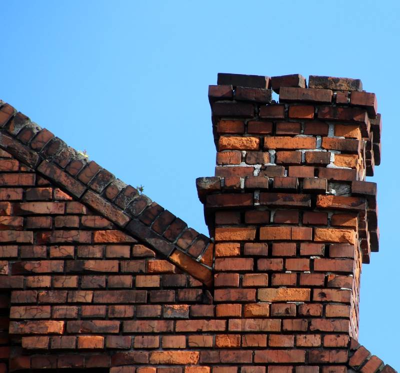 Damaged chimney on an Bethesda home showing cracks and missing mortar